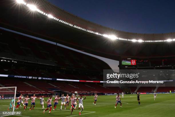 General view inside the stadium as players compete for the ball in the penalty area during the La Liga match between Club Atletico de Madrid and Real...