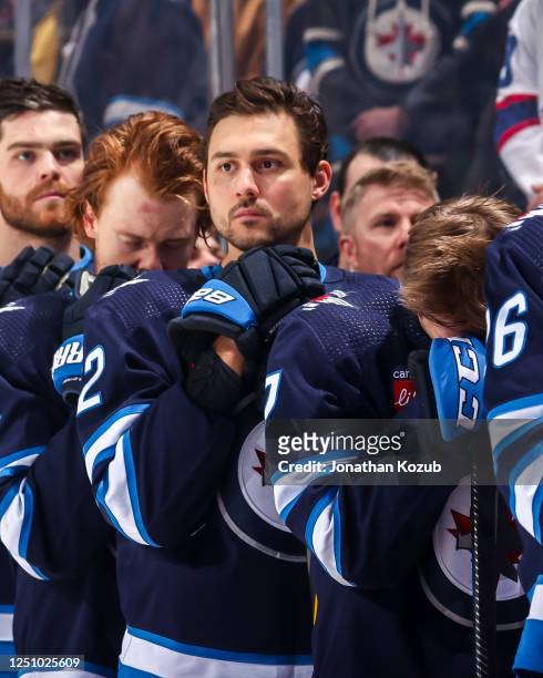 Nino Niederreiter of the Winnipeg Jets looks on from the bench prior to puck drop against the Nashville Predators at the Canada Life Centre on April...