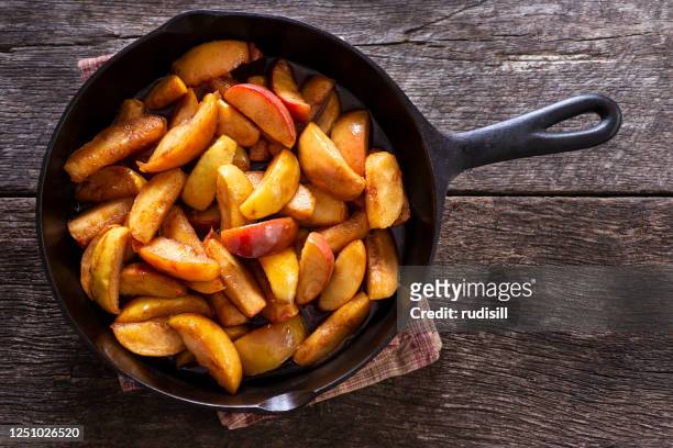cinnamon apple skillet - frying pan from above stock pictures, royalty-free photos & images