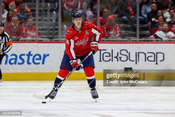 John Carlson of the Washington Capitals looks to make a pass during a game against the Florida Panthers at Capital One Arena on April 8, 2023 in...