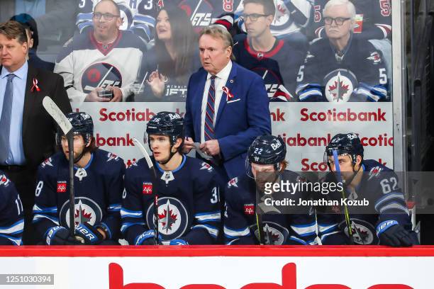 Head Coach Rick Bowness of the Winnipeg Jets looks on from the bench prior to puck drop against the Nashville Predators at the Canada Life Centre on...