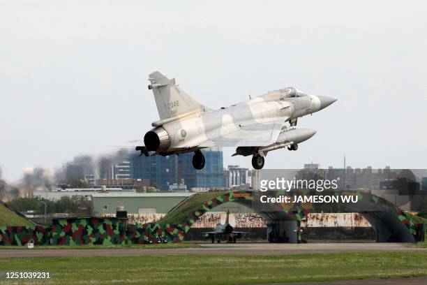 Taiwanese air force Mirage 2000 fighter jet lands at an air force base in Hsinchu, northern Taiwan on April 9, 2023. - China was conducting a second...