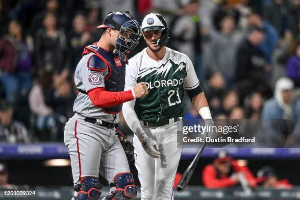 Riley Adams of the Washington Nationals reacts after Kris Bryant of the Colorado Rockies strikes out to end the ninth inning of a game at Coors Field...