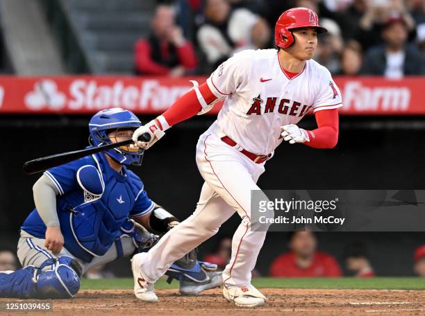 Shohei Ohtani of the Los Angeles Angels hits a double in the fourth inning of the game against the Toronto Blue Jays at Angel Stadium of Anaheim on...