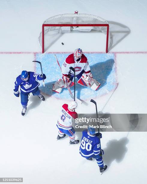 Erik Gustafsson of the Toronto Maple Leafs celebrates his goal against Sam Montembeault of the Montreal Canadiens during the third period at the...