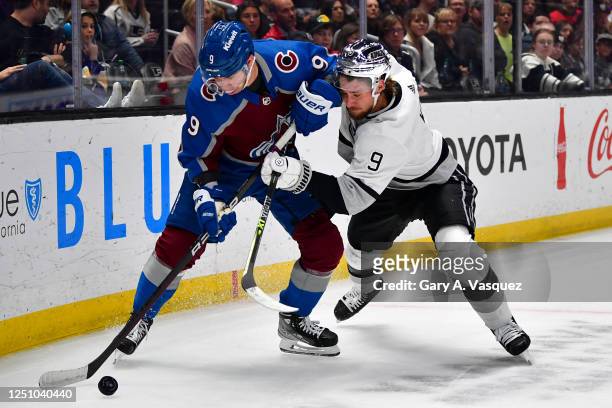 Evan Rodrigues of the Colorado Avalanche and Adrian Kempe of the Los Angeles Kings battle for position during the first period at Crypto.com Arena on...