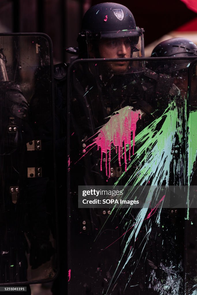 A police officer's shield seen with ink thrown by protesters during ...