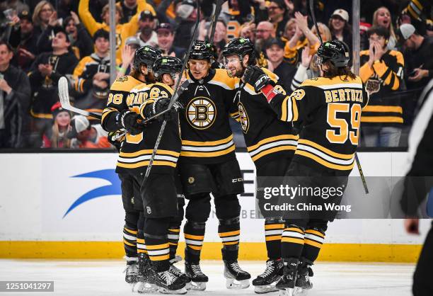 Pavel Zacha of the Boston Bruins celebrates his first period goal with teammates, Tyler Bertuzzi, David Pastrnak, Brad Marchand, and Hampus Lindholm...