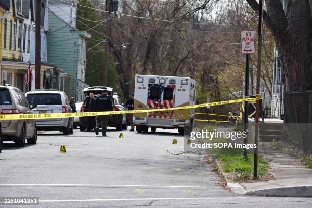 Evidence markers seen at the crime scene. CBS News reported that a local police officer was shot while responding to a domestic violence call on...