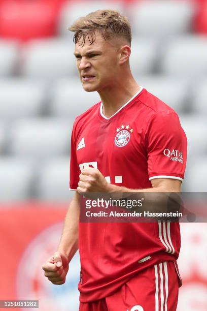 Joshua Kimmich of Bayern Muenchen celebrates after he scores the opening goal during the Bundesliga match between FC Bayern Muenchen and Sport-Club...