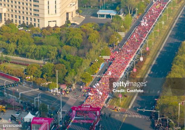 Runners run during the Huai 'an Marathon in Huai 'an city, Jiangsu province, China, April 9, 2023. 15,000 runners from 14 countries, including South...