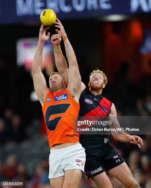 Matt Flynn of the Giants and Andrew Phillips of the Bombers compete for the ball during the 2023 AFL Round 04 match between the Essendon Bombers and...