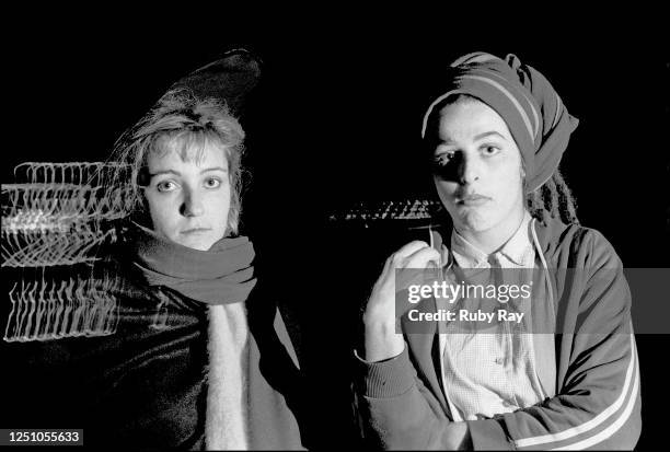 All girl band, the Slits from the UK on their first US tour. Viv Albertine and Ari Up on a roof in San Francisco with lights of the city. 1981