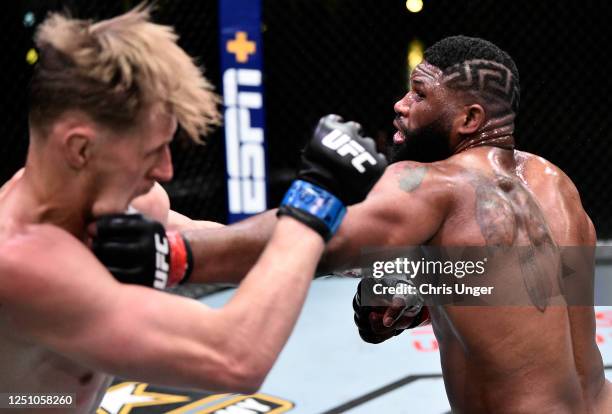 Curtis Blaydes punches Alexander Volkov of Russia in their heavyweight bout during the UFC Fight Night event at UFC APEX on June 20, 2020 in Las...