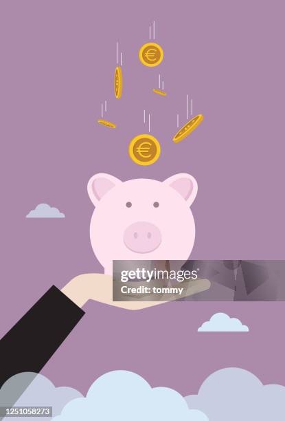 geschäftsmann hebt sparschwein mit fallender euro-münze - piggy bank stock-grafiken, -clipart, -cartoons und -symbole