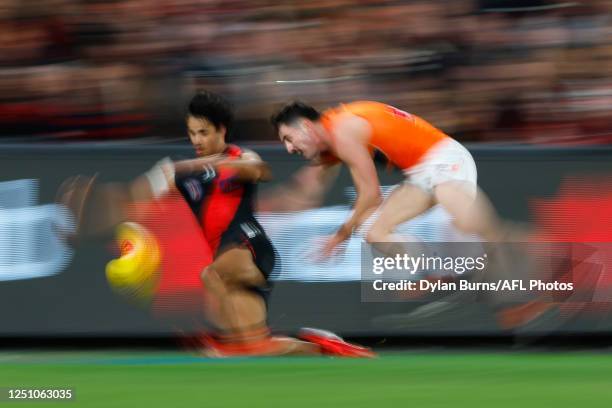 Alwyn Davey Jnr of the Bombers and Lachie Ash of the Giants compete for the ball during the 2023 AFL Round 04 match between the Essendon Bombers and...