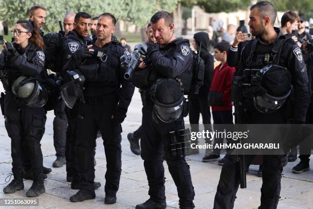 Israeli security forces escort Jewish visitors at the Al-Aqsa mosque compound, also known as the Temple Mount complex to Jews, in Jerusalem on April...