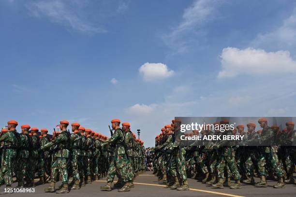 Indonesia's Air Force soldiers take part in a parade to mark the 77th anniversary of the Indonesian Air Force at the Halim Perdanakusuma airport in...