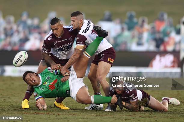 Josh Papalii of the Raiders is tackled during the round six NRL match between the Canberra Raiders and the Manly Sea Eagles at Campbelltown Stadium...