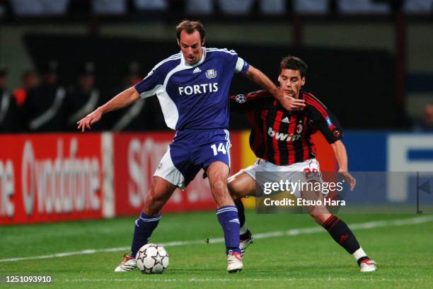 Bart Goor of Anderlecht controls the ball under pressure of Yoann Gourcuff of AC Milan during the UEFA Champions League Group H match between AC...