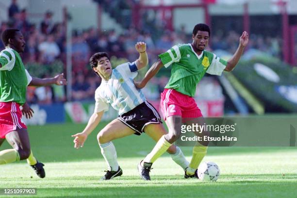 Diego Maradona of Argentina and Andre Kana-Biyik of Cameroon compete for the ball during the FIFA World Cup Italy Group B match between Argentina and...
