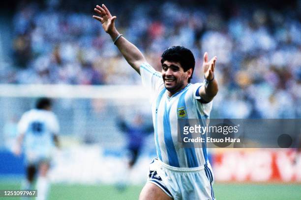 Diego Maradona of Argentina celebrates his side's first goal by Claudio Caniggia during the FIFA World Cup Italy Round of 16 match between Brazil and...