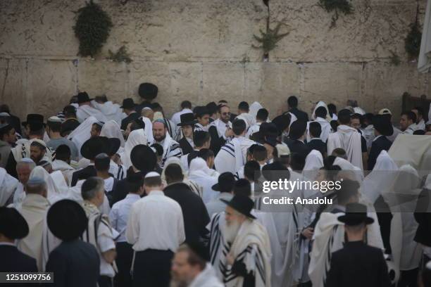 Jewish people pray at a ceremony during the Passover holiday at Western Wall in East Jerusalem, on April 09, 2023.