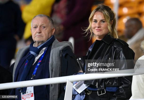 Olympique Lyonnais' French president Jean-Michel Aulas and France's midfielder Amandine Henry attend during the Women's international friendly...