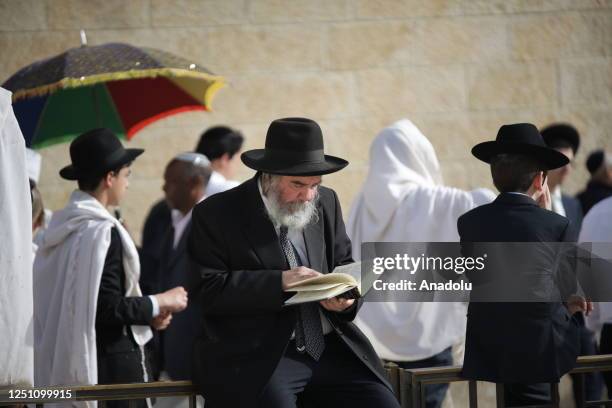 Jewish people pray at a ceremony during the Passover holiday at Western Wall in East Jerusalem, on April 09, 2023.