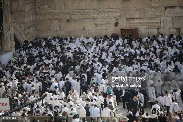 Jewish people pray at a ceremony during the Passover holiday at Western Wall in East Jerusalem, on April 09, 2023.