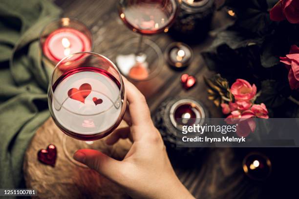 romantic still life with red wine in glass. - valentines day dinner foto e immagini stock