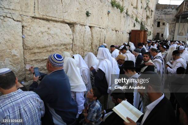 Jewish people pray at a ceremony during the Passover holiday at Western Wall in East Jerusalem, on April 09, 2023.