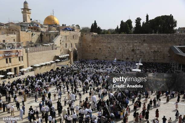 Jewish people pray at a ceremony during the Passover holiday at Western Wall in East Jerusalem, on April 09, 2023.