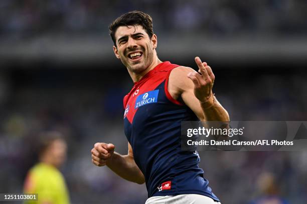 Christian Petracca of the Demons responds to the crowd after kicking a goal during the 2023 AFL Round 04 match between the West Coast Eagles and the...