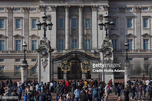 Tourists outside Buckingham Palace on April 9, 2023 in London, England. The Coronation of King Charles III and The Queen Consort will take place on...