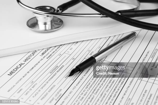 medical history record form and stethoscope - medisch document stockfoto's en -beelden
