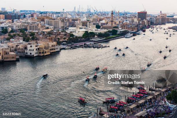 dubai creek in deira with the view of old dubai in united arab emirates - dubai water canal stock pictures, royalty-free photos & images