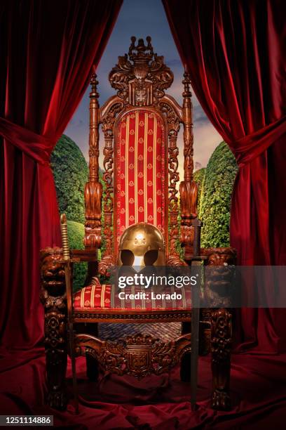 historical helmet on the throne in studio shoot - medieval throne stock pictures, royalty-free photos & images