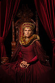 Historical blonde saintly Queen character on the throne