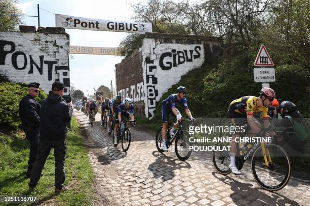 Jumbo-Visma team's Belgian rider Wout Van Aert cycles over the Pont Gibus cobblestone sector during the 120th edition of the Paris-Roubaix one-day...