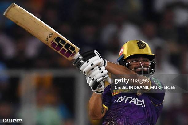 Kolkata Knight Riders' Rinku Singh plays a shot during the Indian Premier League Twenty20 cricket match between Gujarat Titans and Kolkata Knight...