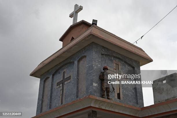 Member of the Frontier Constabulary stands guard at the Bethel Memorial Methodist Church in Quetta on April 9, 2023.