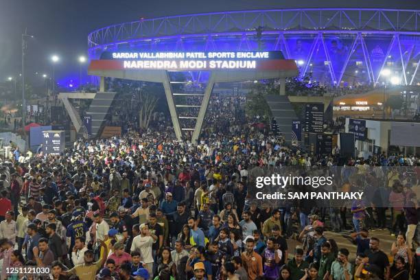 Spectators leave the Narendra Modi Stadium after watching the Indian Premier League Twenty20 cricket match between Gujarat Titans and Kolkata Knight...