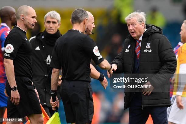 Crystal Palace's English manager Roy Hodgson shakes hands with the officials on the pitch after the English Premier League football match between...