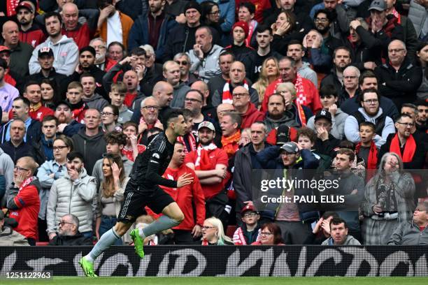 Arsenal's Brazilian midfielder Gabriel Martinelli celebrates scoring the opening goal during the English Premier League football match between...