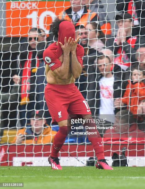 Liverpool's Mohamed Salah reacts to missing a goal during the Premier League match between Liverpool FC and Arsenal FC at Anfield on April 9, 2023 in...
