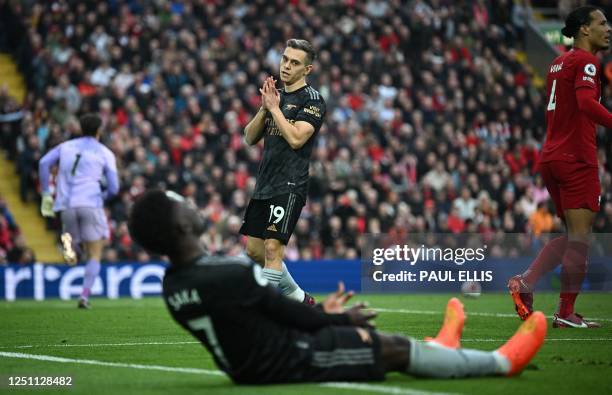 Arsenal's Belgian midfielder Leandro Trossard reacts after failing to connect with a cross from Arsenal's English midfielder Bukayo Saka during the...