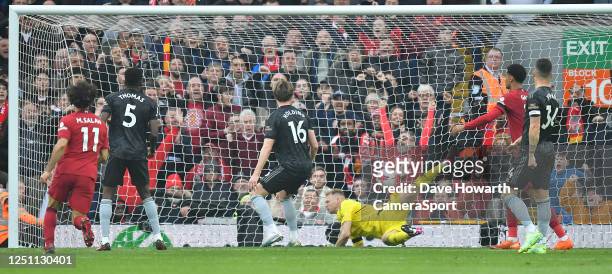 Arsenal's Aaron Ramsdale could not keep out Liverpools second goal during the Premier League match between Liverpool FC and Arsenal FC at Anfield on...