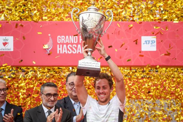 Spains Roberto Carballes Baena celebrates with the trophy after defeating France's Alexandre Muller during the men's single final tennis match at the...