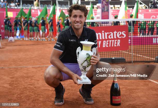 Casper Ruud of Norway celebrates holding the trophy after winning the final match during the Millennium Estoril Open ATP 250 tennis tournament at the...